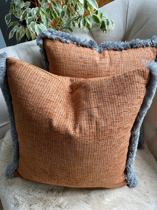 TRUENO - Handmade rust and grey woven fabric cushion cover with fringe