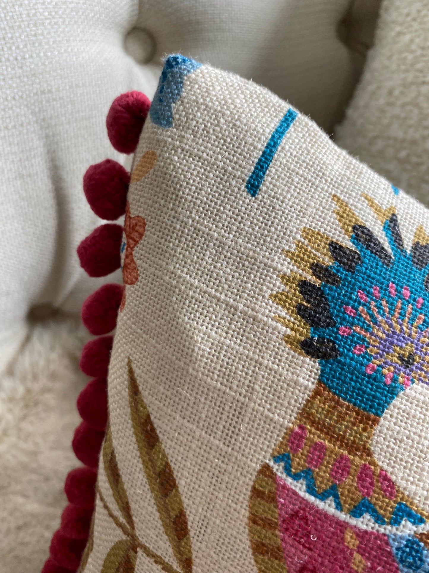 PARADISA - Handmade lumbar cushion cover with modern botanical design and pom pom trim.