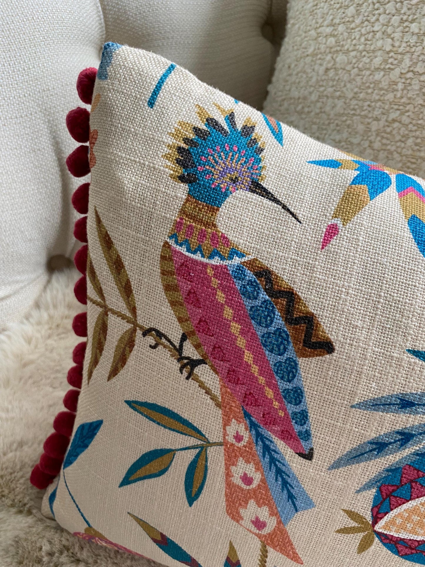 PARADISA - Handmade lumbar cushion cover with modern botanical design and pom pom trim.