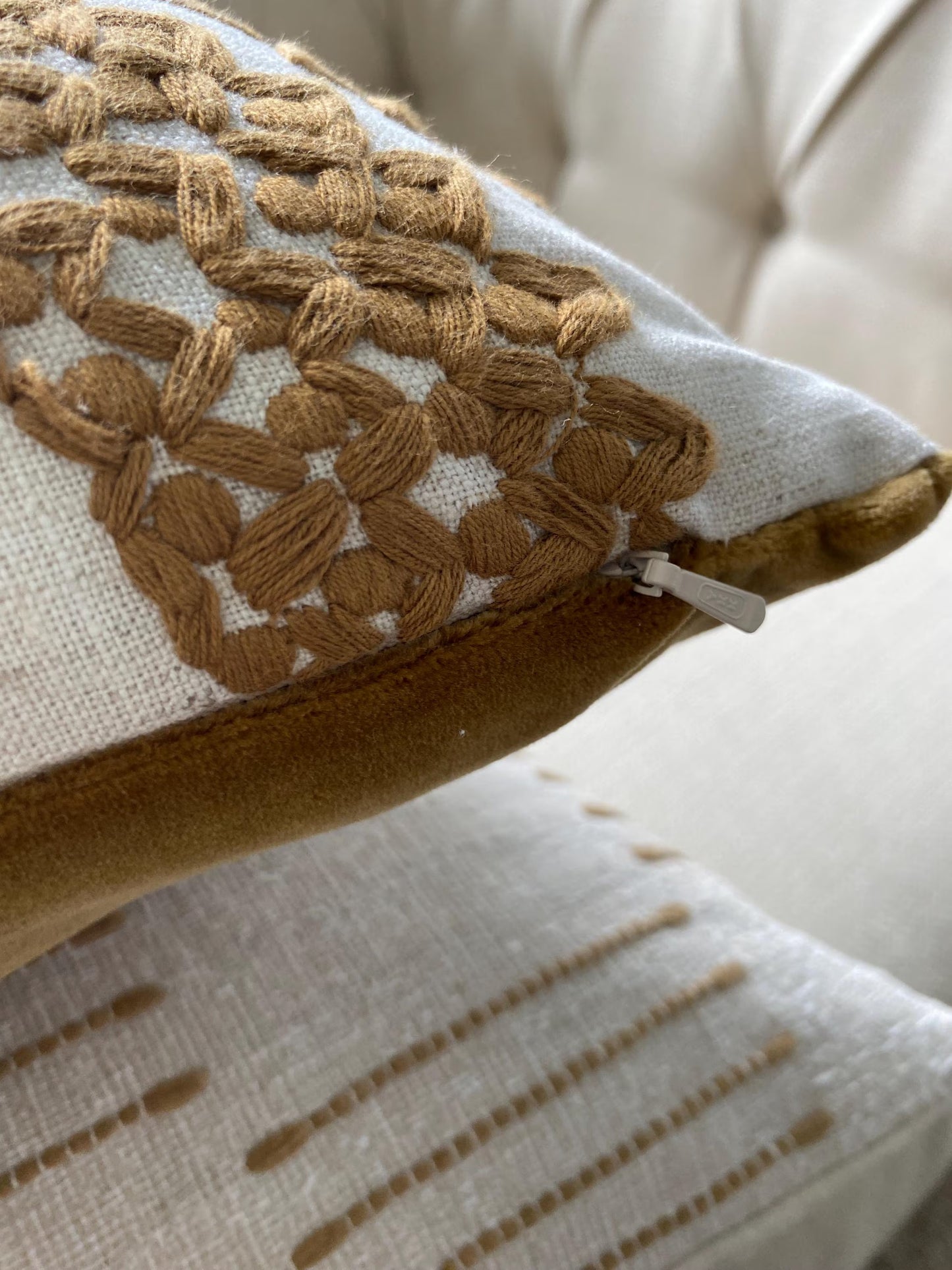 SAFI- Handmade cushion cover with cinnamon embroidered circular motifs on cream background.