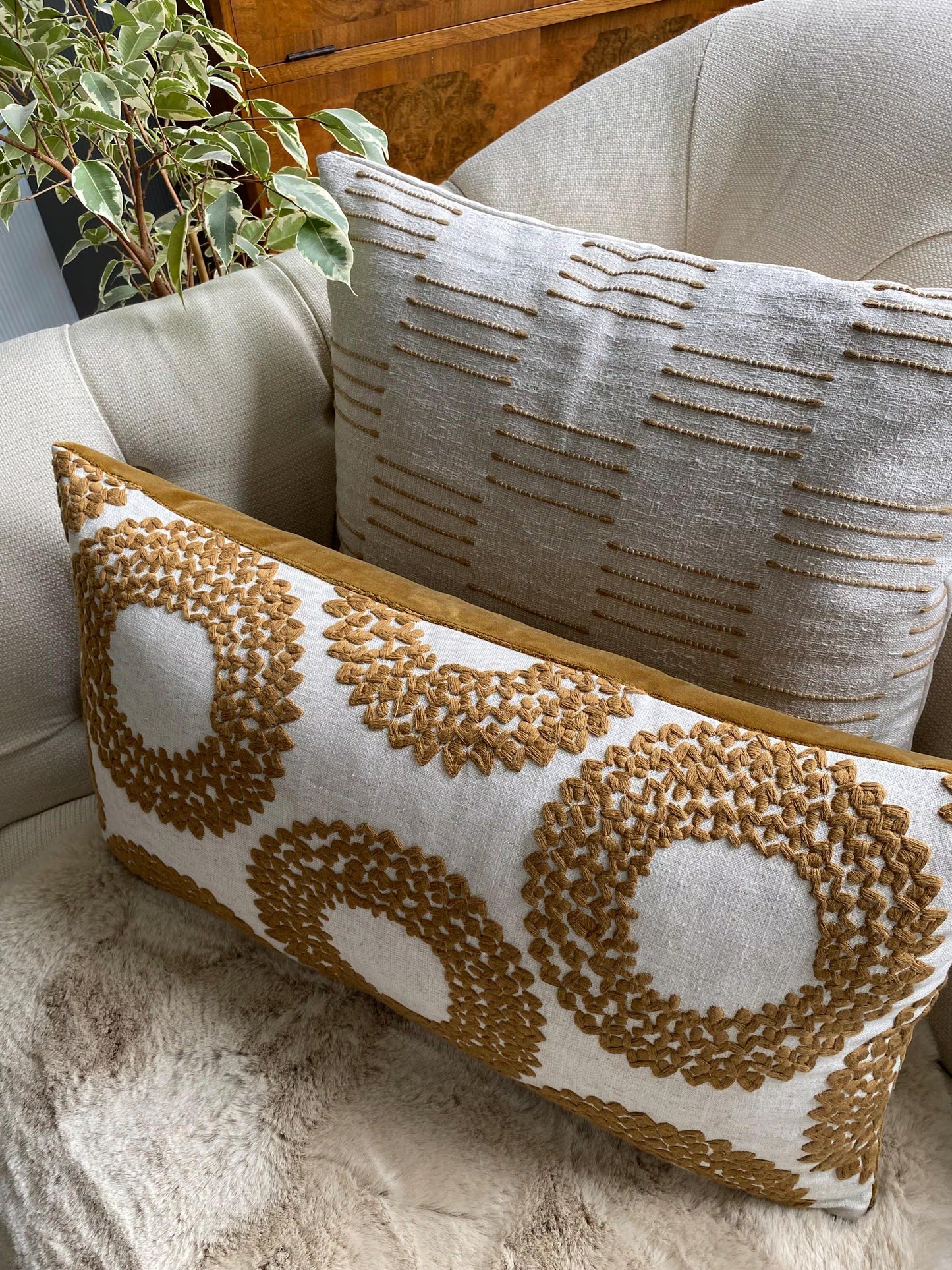 SAFI- Handmade cushion cover with cinnamon embroidered circular motifs on cream background.