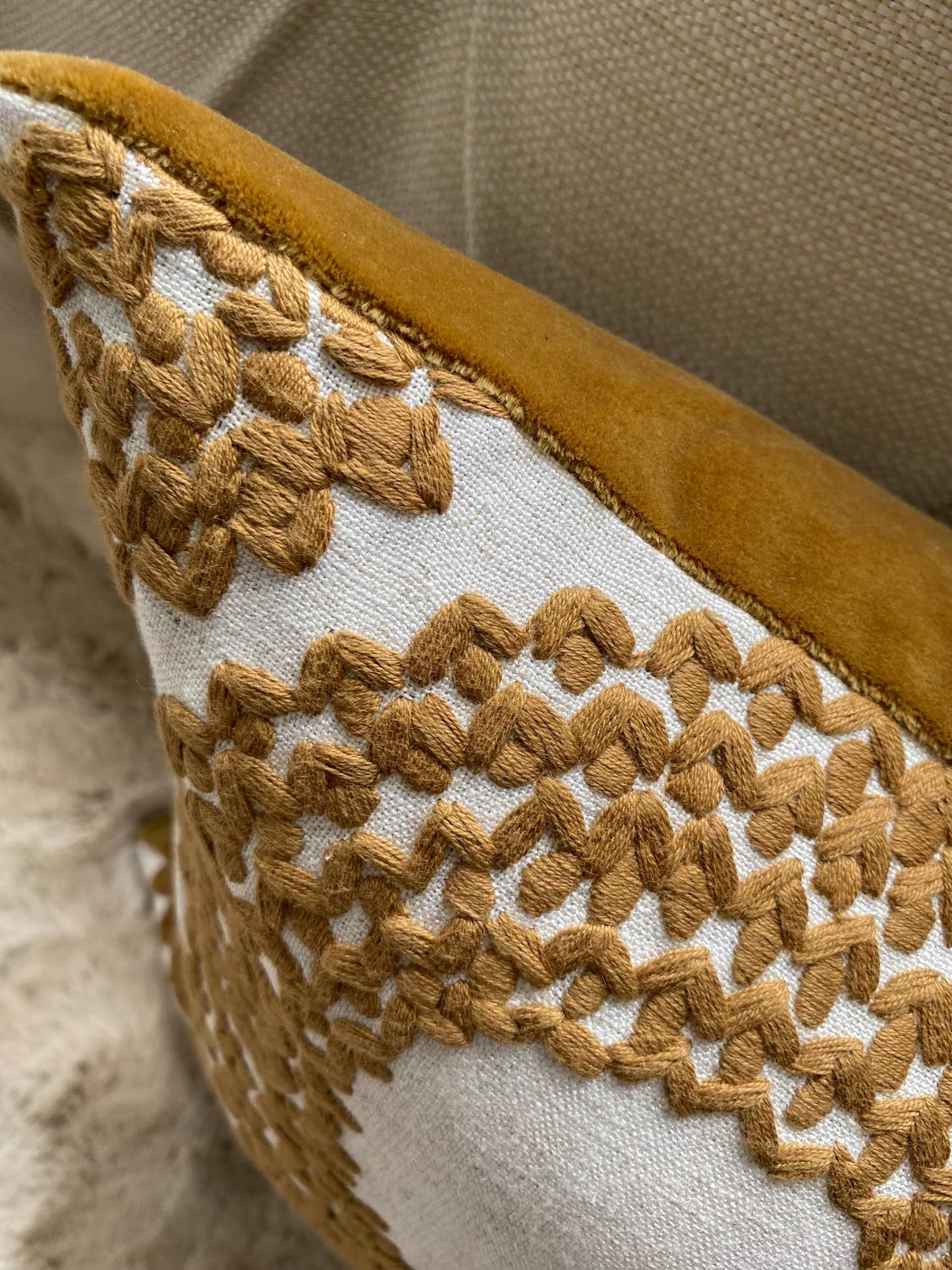 SAFI- Handmade cushion cover with cinnamon embroidered circular motifs on cream background.